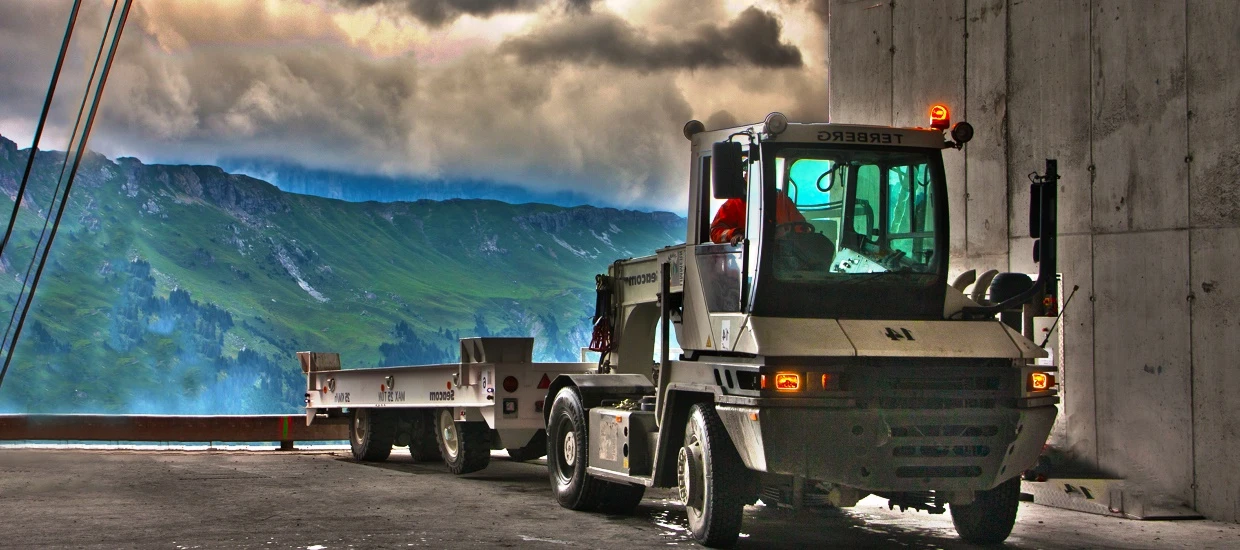 Seacom heavy-duty trailer with terminal tractor at dusk